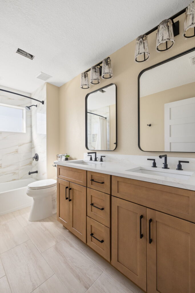 Modern bathroom with wooden vanity and dual sinks