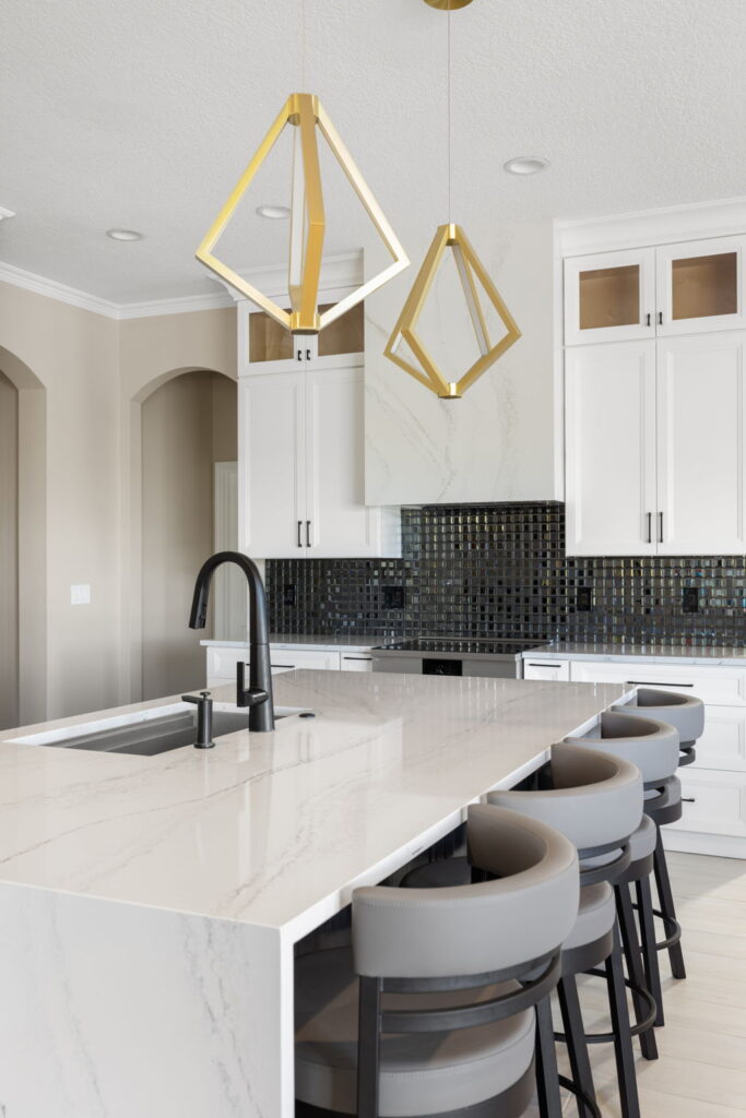Modern kitchen with white cabinets and island counter