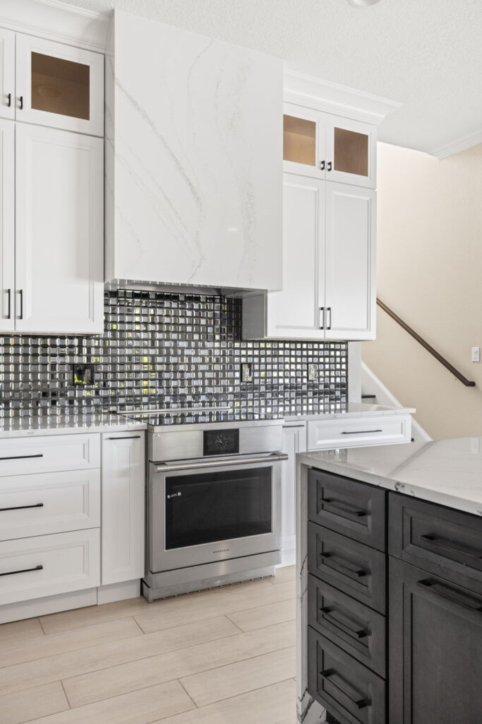Modern kitchen with stainless steel appliances and cabinets.