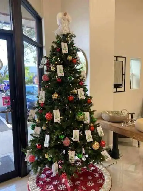 Christmas tree with ornaments and angel topper.