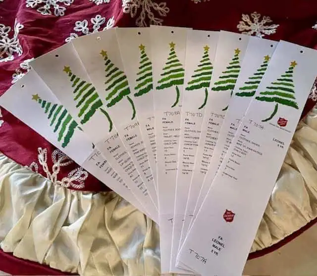 Green tree lists fanned out on red fabric.