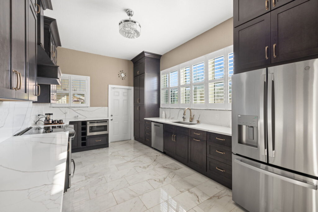 White countertop kitchen with dark cabinets
