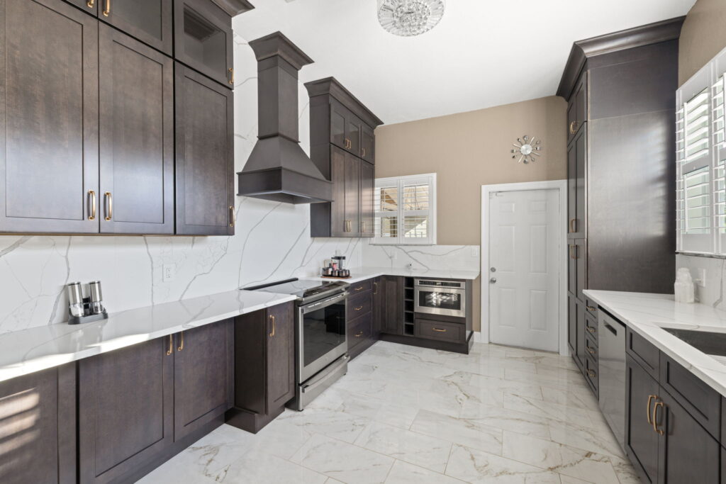 White countertop kitchen with dark cabinets remodeled