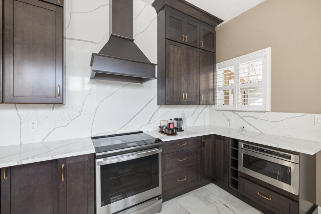 White countertop kitchen with dark cabinets