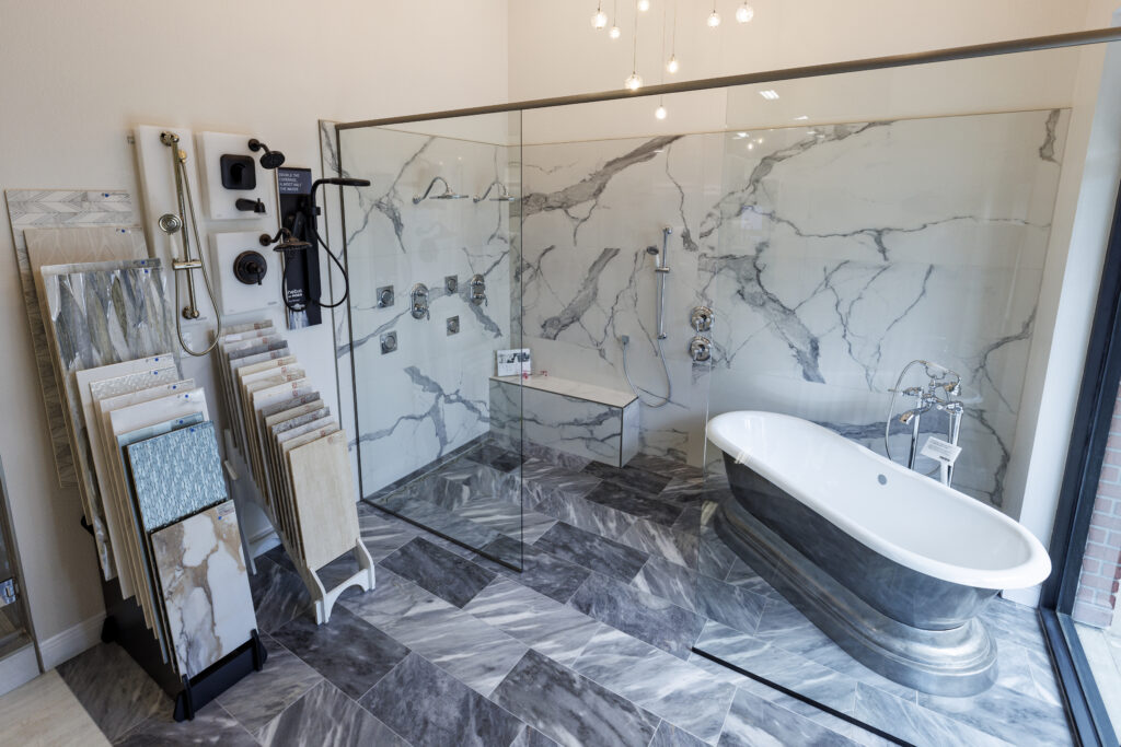 Elegant bathroom with marble shower and freestanding tub.