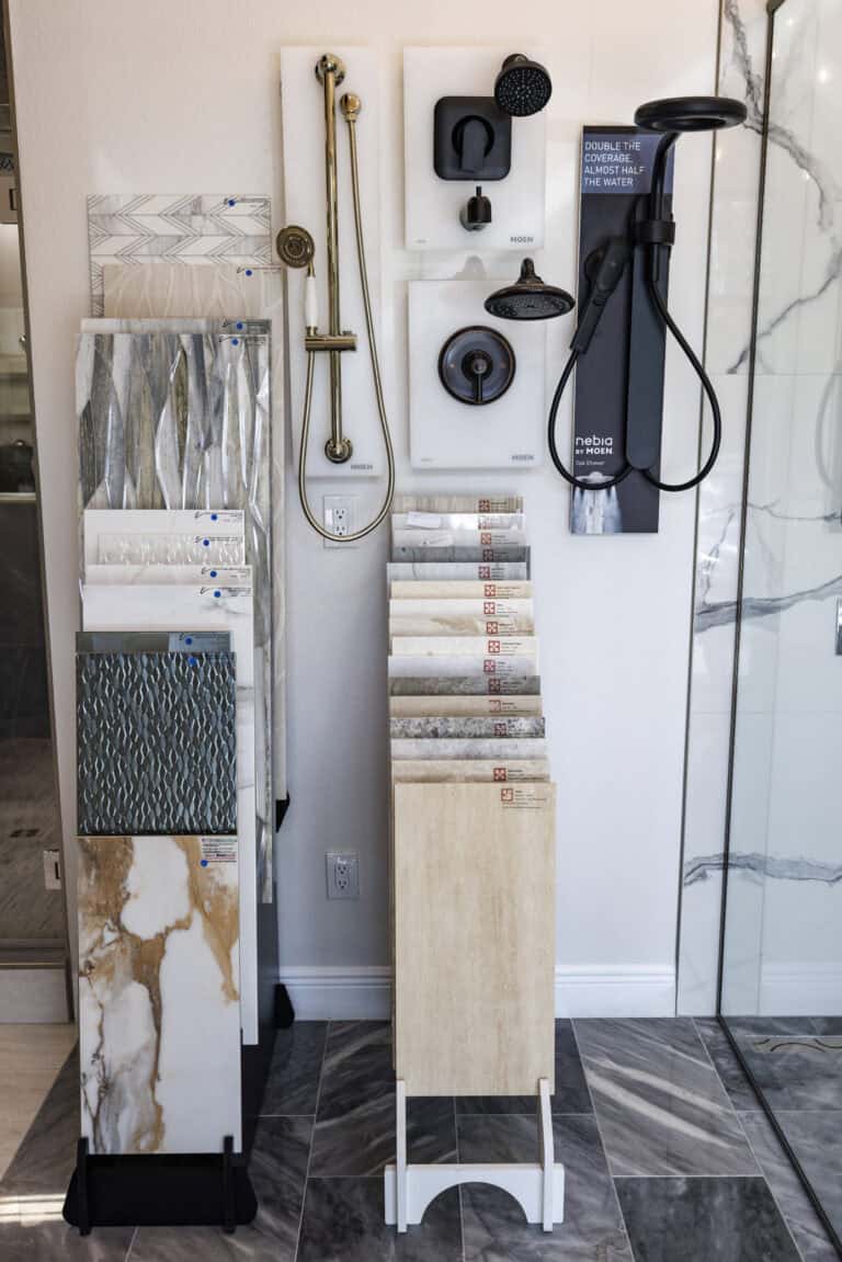 Marble and shower head examples in a modern showroom.