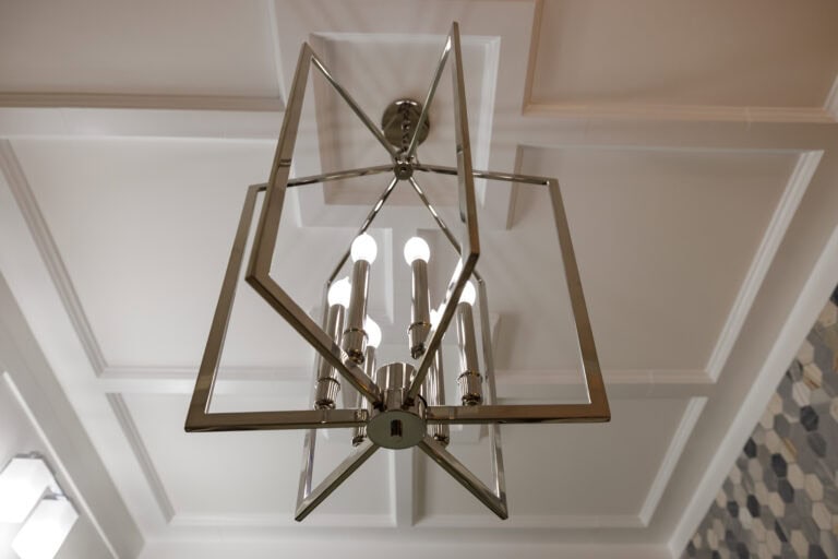 An elegant chandelier inside a modern home.