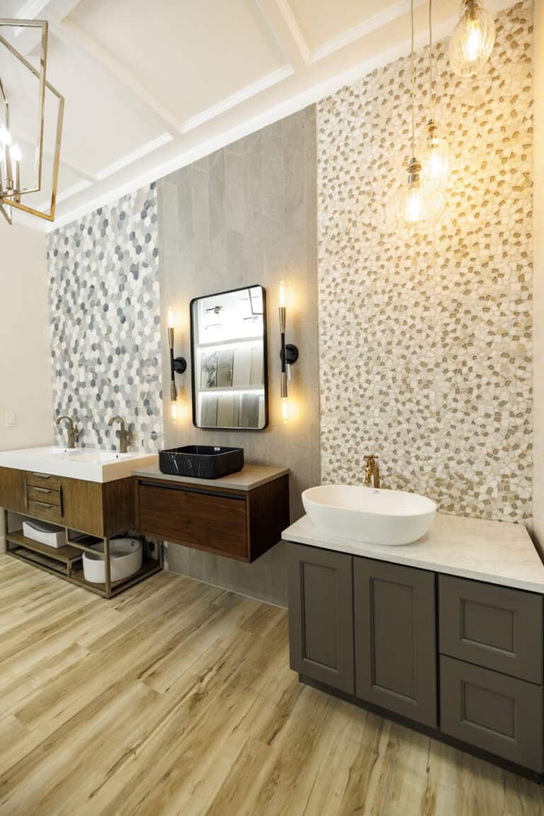 Two example bathroom sinks with exquisite basins in a modern showroom.