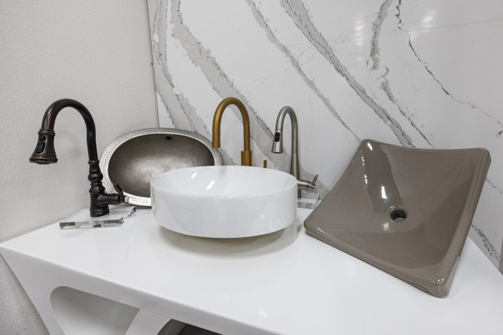 Variety of modern bathroom sinks and faucets.