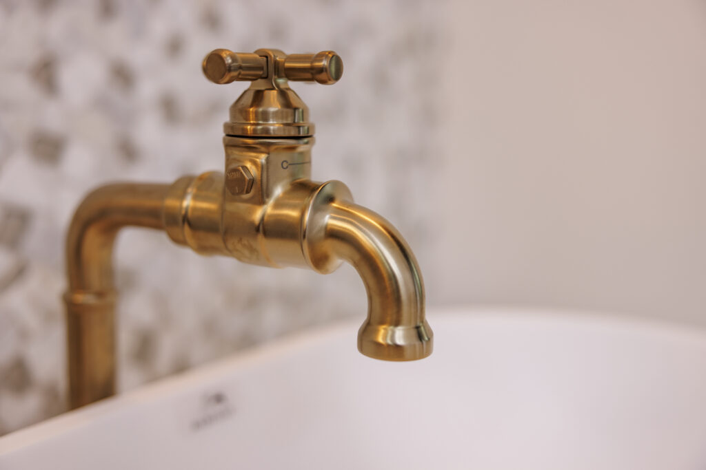 Close-up of a stylish brass faucet