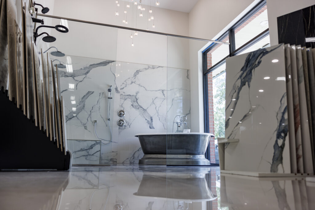Stylish bathroom with marble tiles and modern bathtub.