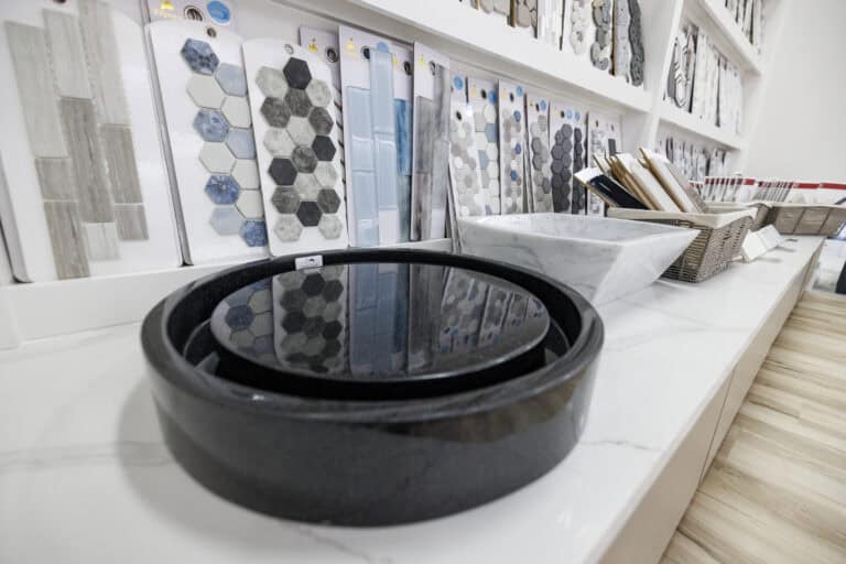 Showroom feature of several modern sink basins and color swatches.