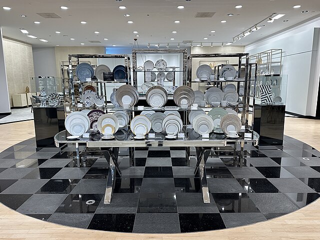 Display of decorative plates in a modern store.