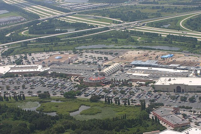 Aerial view of shopping mall and surrounding area.