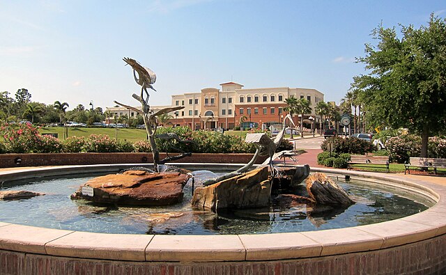Sculptural fountain with rocks in public park.