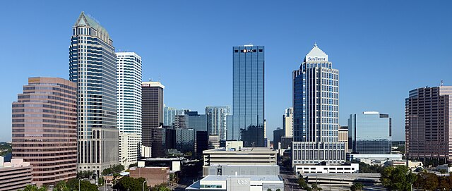 City skyline featuring modern skyscrapers and clear skies.