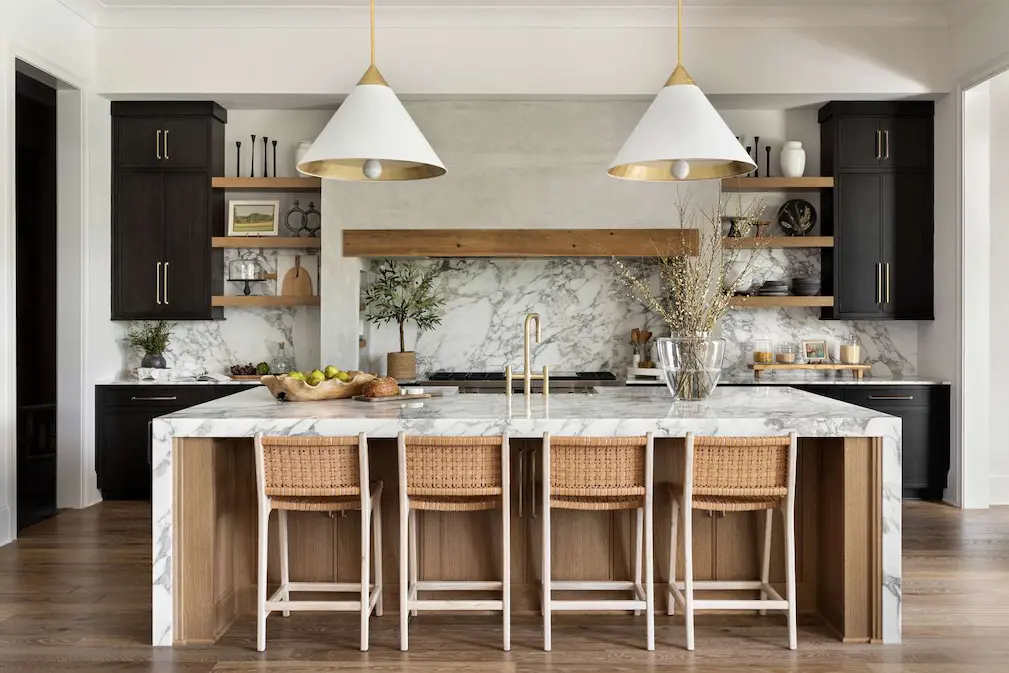 a bright tampa kitchen featuring a large white quartz waterfall island with subtle veining