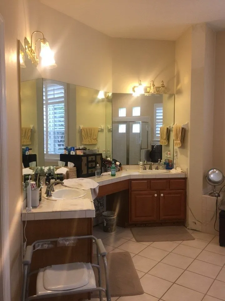 1990s primary bathroom before remodeling in New Tampa with tiled countertops and angled corner vanity