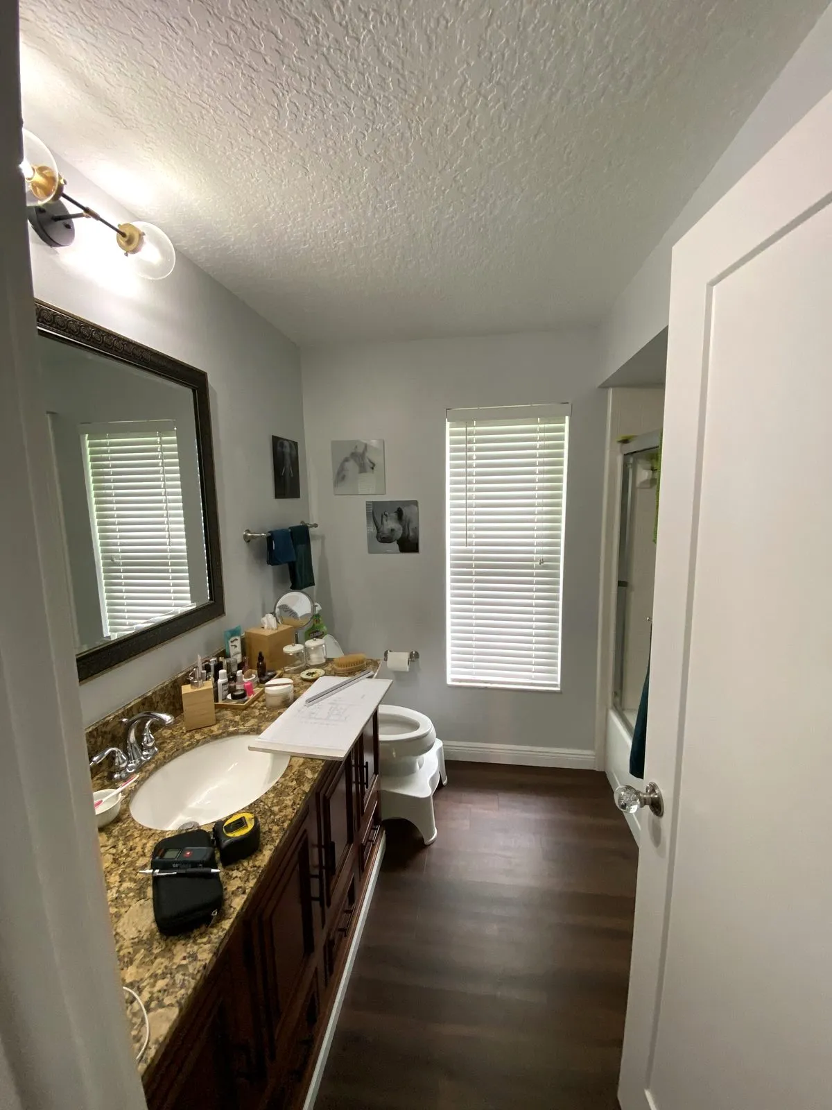 Second angle of the Safety Harbor guest bathroom before its remodel, showing dated finishes