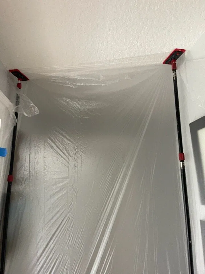 Plastic dust containment sealing the work area during a Safety Harbor bathroom remodel