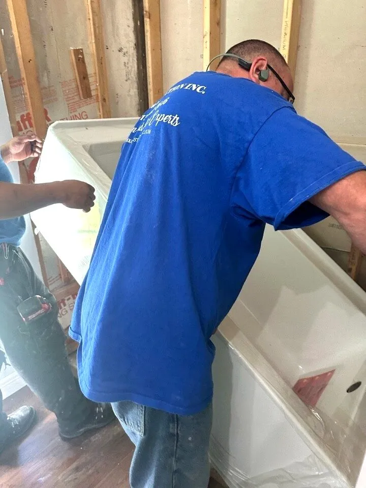 CMK Construction in house plumbers set the new tub and complete rough plumbing in a gutted Safety Harbor bathroom
