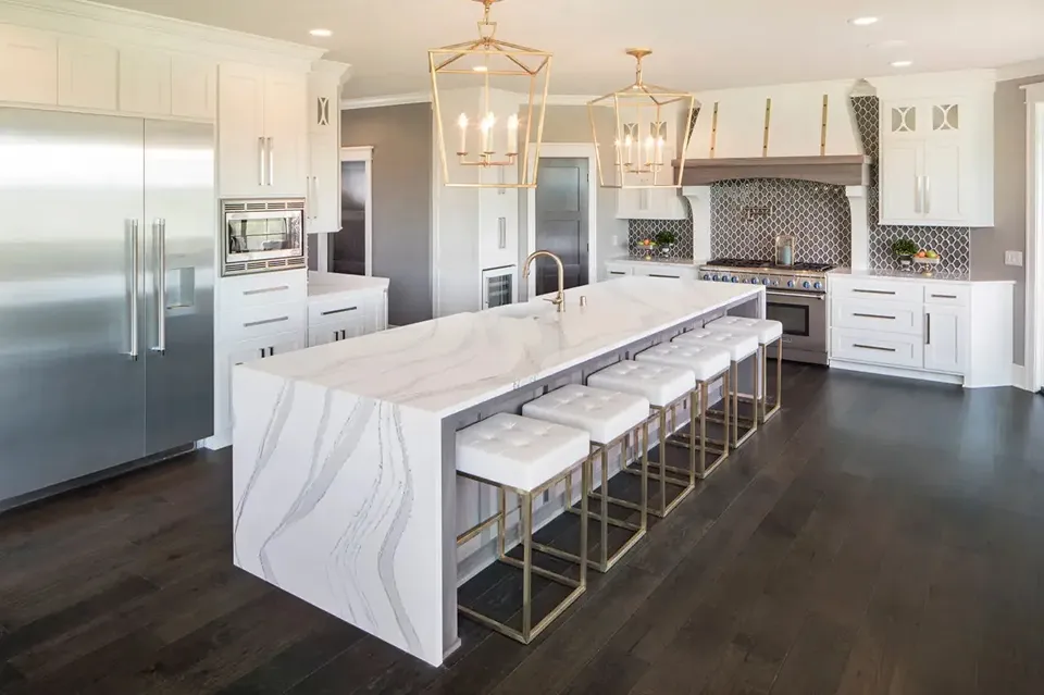 Cambria Brittanicca quartz countertops on a waterfall island in a Tampa kitchen with white cabinetry