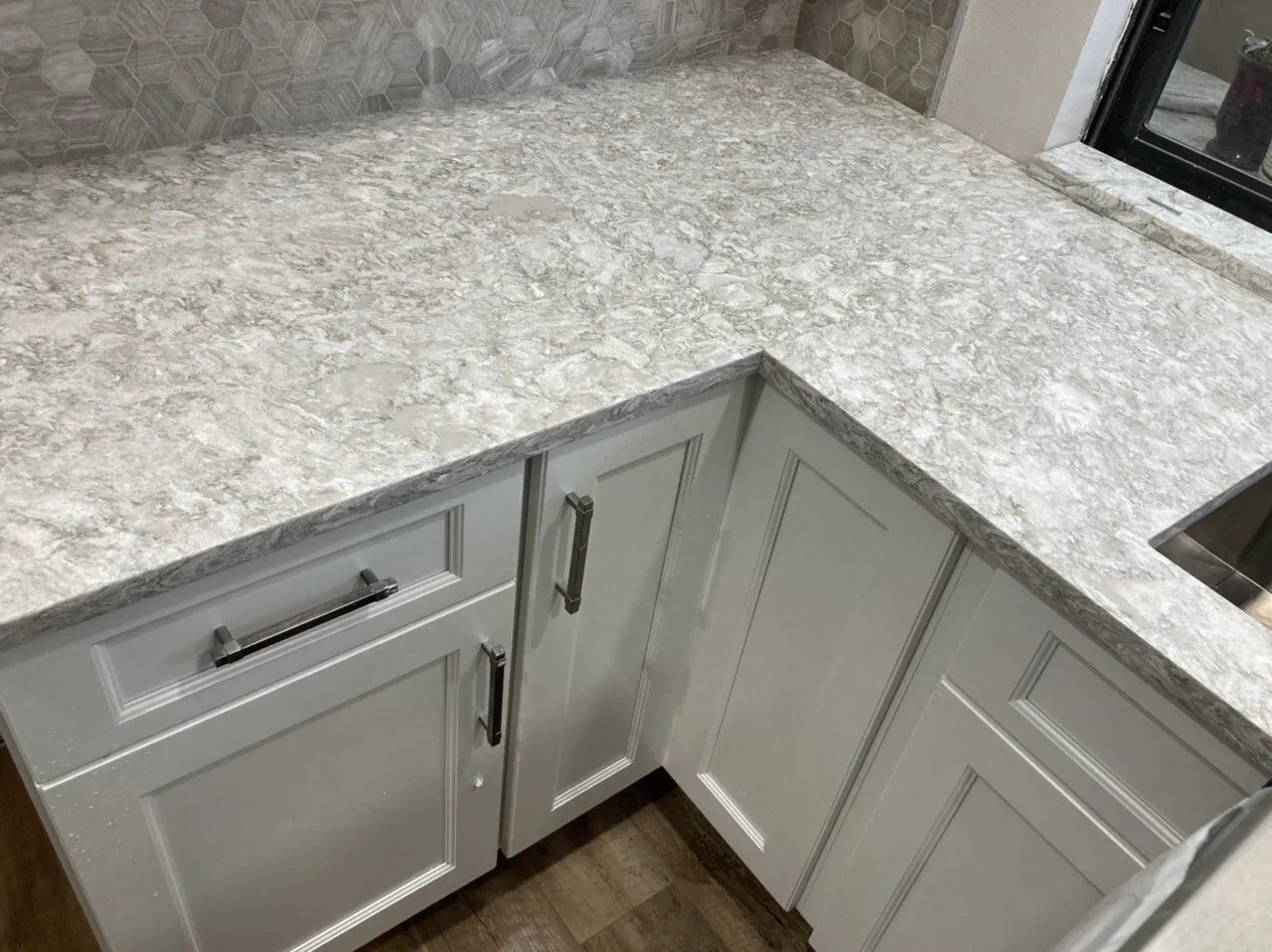 Cambria Chatsworth quartz countertop detail with hexagon tile backsplash in a Clearwater FL kitchen remodel