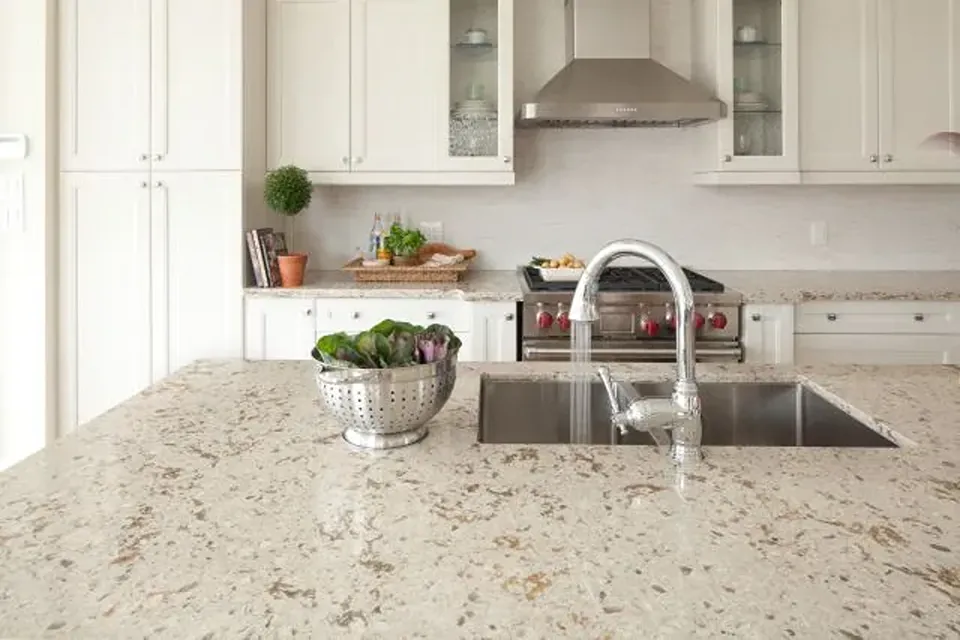 Cambria Windermere warm beige granular quartz countertop with white cabinets