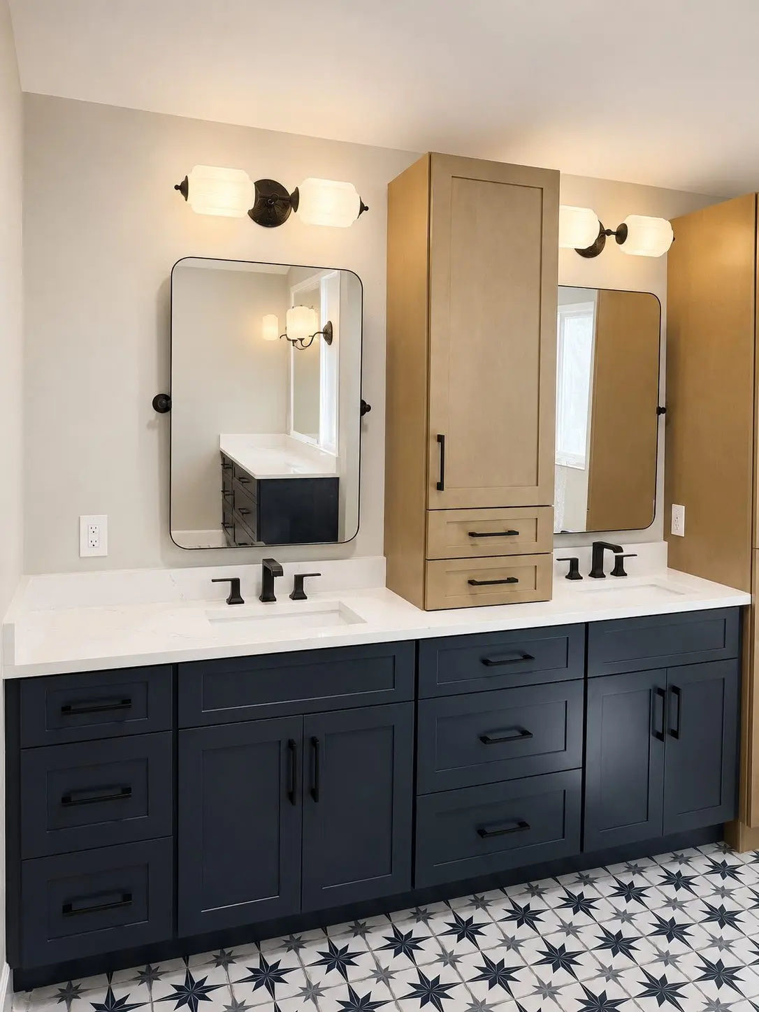 Navy double vanity with white oak countertop storage tower and quartz tops in a Tampa bathroom remodel