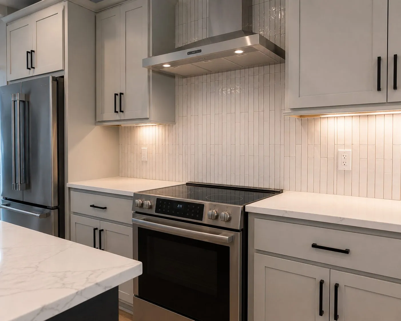 Vertical stacked skinny tile backsplash running to the ceiling in an Odessa kitchen remodel by CMK Construction