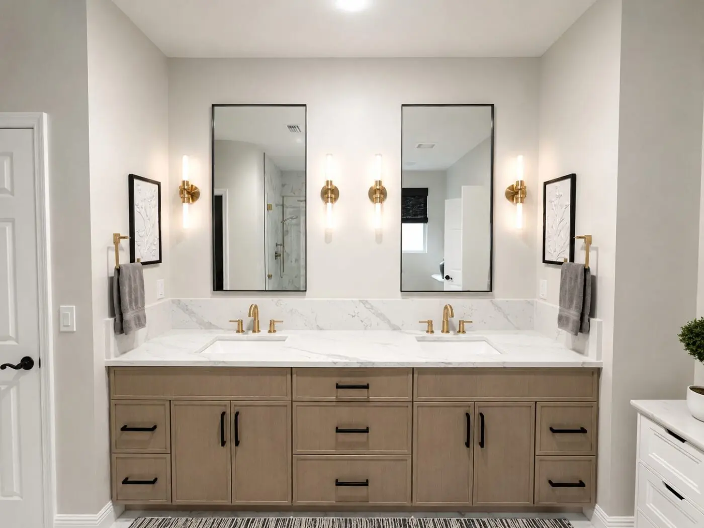 White oak double vanity with quartz countertop and brushed gold faucets in a Seminole bathroom remodel
