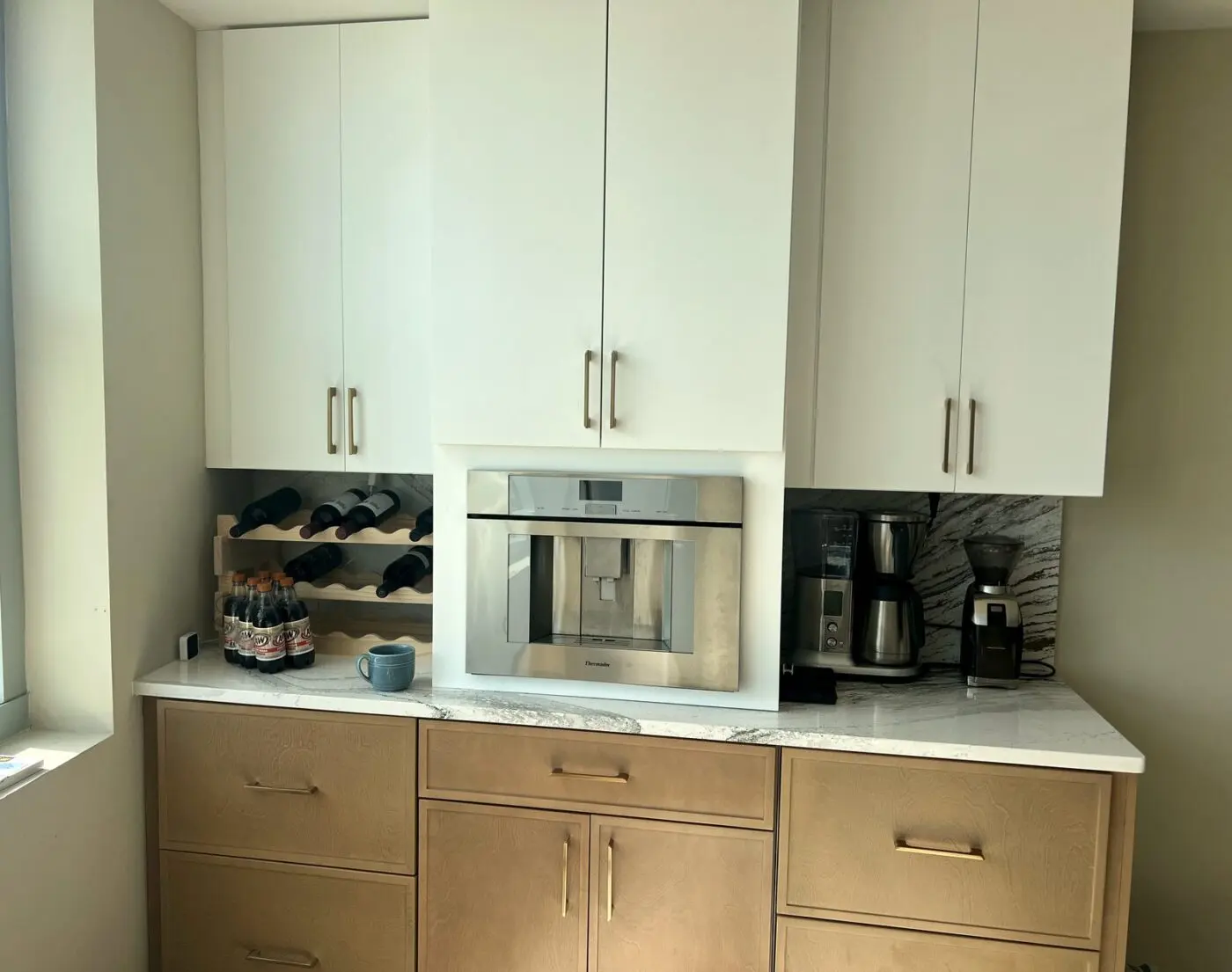 white and wood tone coffee bar with built in thermador coffee machine in land o lakes florida by cmk construction